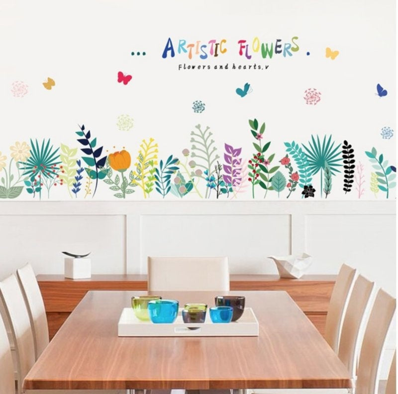 Muursticker assortiment van artistiek gekleurde bloemen strook / plint
