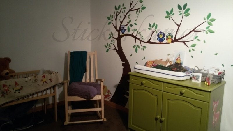 Muursticker jungle boom met groene blaadjes en uilen