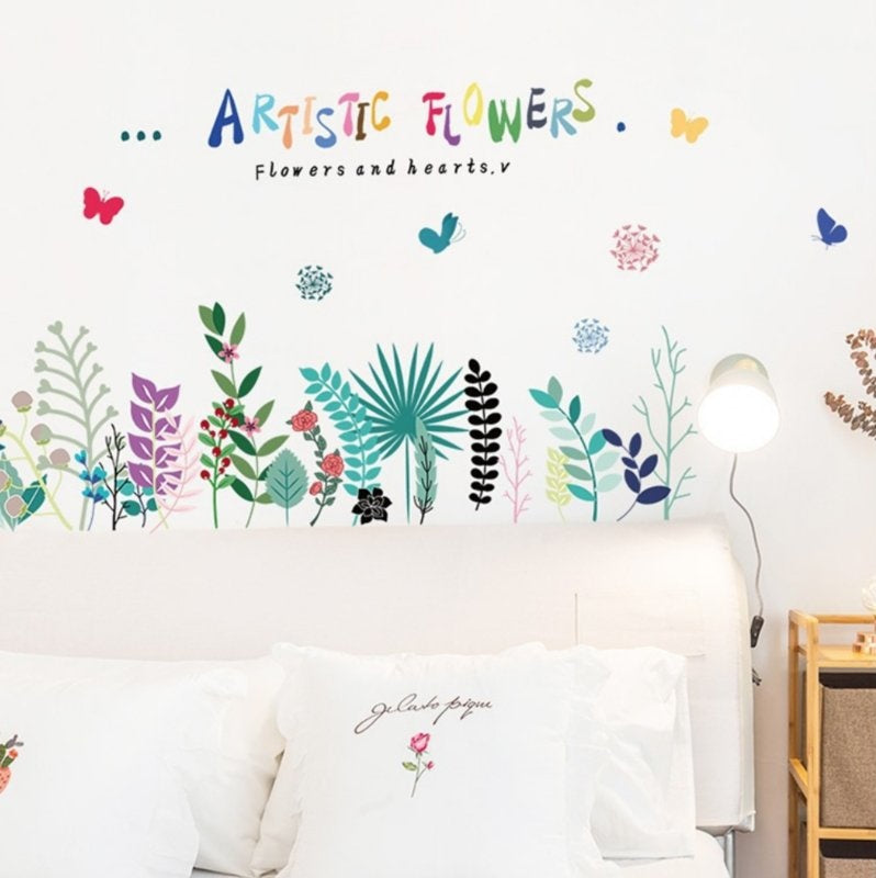 Muursticker assortiment van artistiek gekleurde bloemen strook / plint